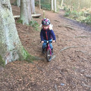 Savannah loves riding her balance bike, she's very confident on it 